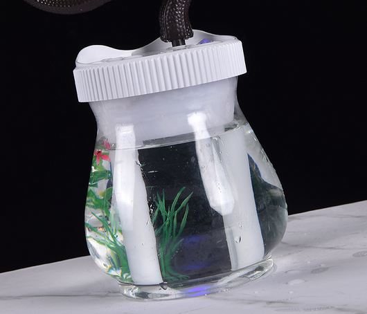 Creative desktop humidifier with artificial red roses, clear base, pink top, and color-changing LED light mist. - Image 15