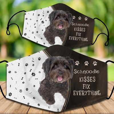 Two cotton face masks with a Bichon Frise dog, paw prints, and bones on a white and brown background. Text reads "Bichon Frise KISSES FIX EVERYTHING." - Image 59