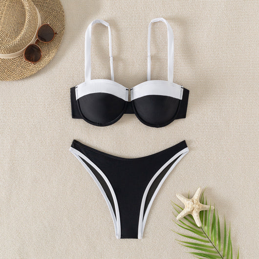 Black and white color block bikini with underwire top and high-cut bottoms, modeled by a woman by a pool. - Image 8