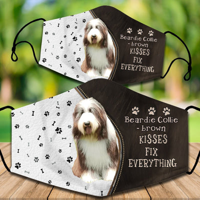 Two cotton face masks with a Bichon Frise dog, paw prints, and bones on a white and brown background. Text reads "Bichon Frise KISSES FIX EVERYTHING." - Image 16