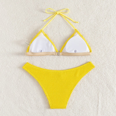 Bright yellow textured two-piece bikini with a triangle top and high-cut bottom, modeled on a person. - Image 9