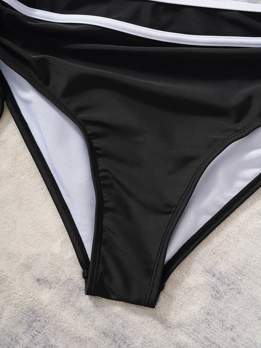 Black and white color matching bikini swimsuit with a high-waisted drawstring bottom and a split top. - Image 14