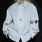 Blusa Blanca con Diseño de Cortes y Costuras Desconstruidas