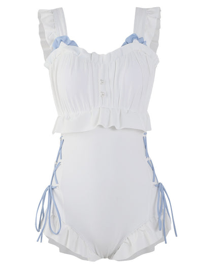 Women's white one-piece swimsuit with light blue lace-up sides, ruffled straps, and pearl-like buttons. - Image 6