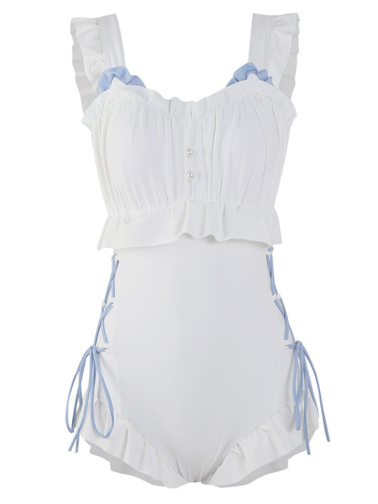 Women's white one-piece swimsuit with light blue lace-up sides, ruffled straps, and pearl-like buttons. - Image 6