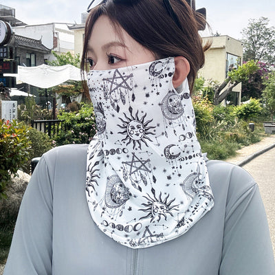 Black paisley sun mask with white pattern and ear loops, covering the lower face and neck, worn outdoors. - Image 2