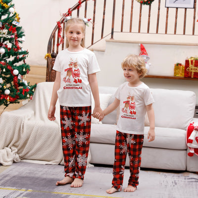 Family of five wearing matching Christmas pajamas with white 'Cousin Crew' tops and red plaid snowflake pants. - Image 11