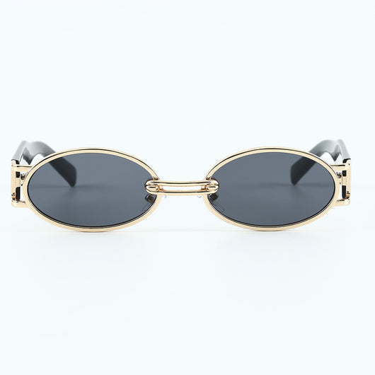 Retro small frame sunglasses with gold round frames and leopard print temples, held by a hand. - Image 14