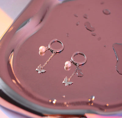 Aretes Mariposa con Perla y Borla Corta