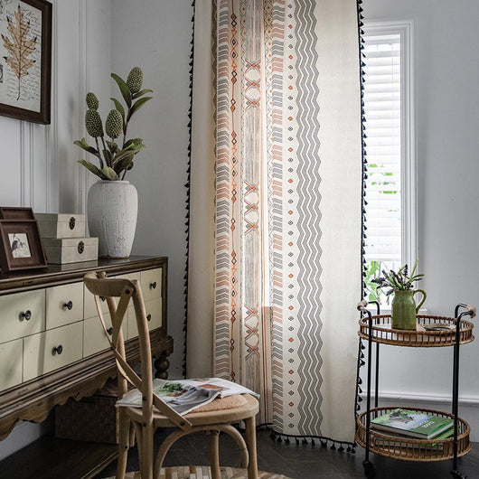 Boho cream cotton and linen curtain with tribal print in black and orange, featuring black fringe tassels. - Image 5
