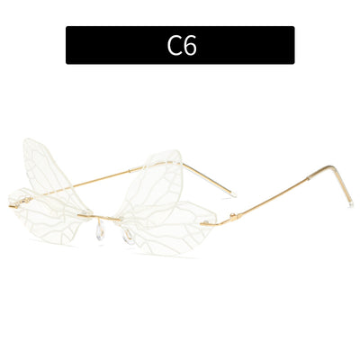 Light green rimless butterfly sunglasses with gold metal frames, featuring a unique veined lens design. - Image 25