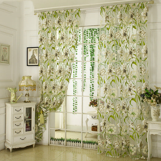 White sheer curtains with a green and beige floral pattern, hanging on a rod in a bright room. - Image 5