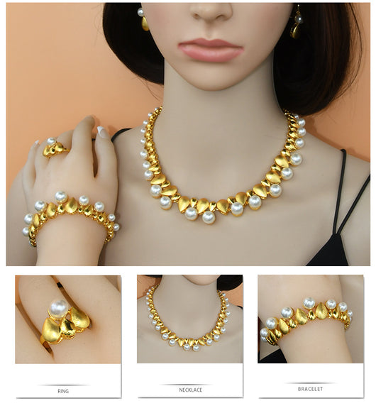 Women's four-piece jewelry set with matte gold teardrop links and white pearls, including a necklace, earrings, ring, and bracelet. - Image 13