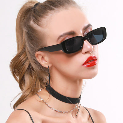 Rectangular tortoiseshell sunglasses with a small frame and dark gray lenses, angled on a white background. - Image 37