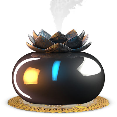 Black spherical aromatherapy humidifier with a lotus flower top, emitting mist, sitting on a gold decorative doily. - Image 5