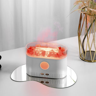 Black desktop humidifier with clear top filled with pink Himalayan salt rocks and rose gold control buttons. - Image 3