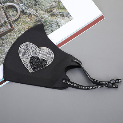Black ear-mounted mask with a sparkling rhinestone bow pattern, featuring adjustable ear loops. - Image 6