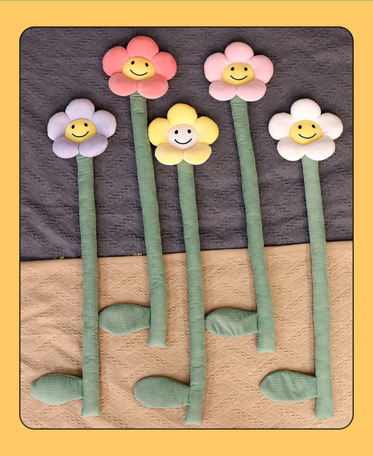 Plush white sunflower curtain buckle with a yellow smiley face center and green stem, holding back a dark green curtain.