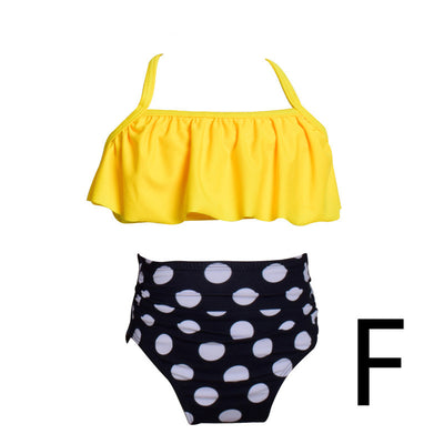 Mother and child in matching peach and green tropical print split bikinis with ruffled tops and high-waisted bottoms. - Image 6