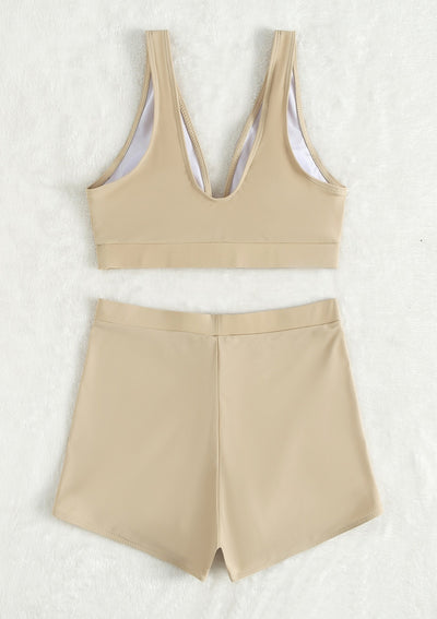 Women's deep-V Halong Bay-style two-piece swimsuit in light beige, featuring a crop top and high-waisted shorts. - Image 8