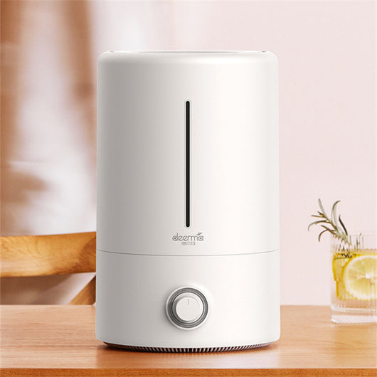 White cylindrical air aroma diffuser with a vertical water level indicator and a control knob on the front. - Image 4