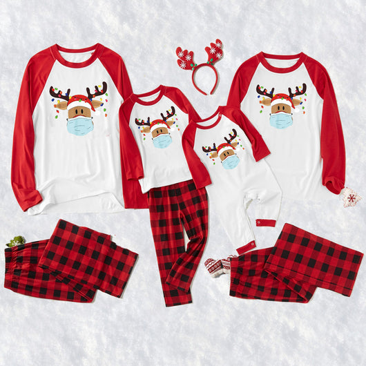 Matching family Christmas pajamas with grey tops, red plaid sleeves, and a reindeer wearing a Santa hat and face mask. - Image 12