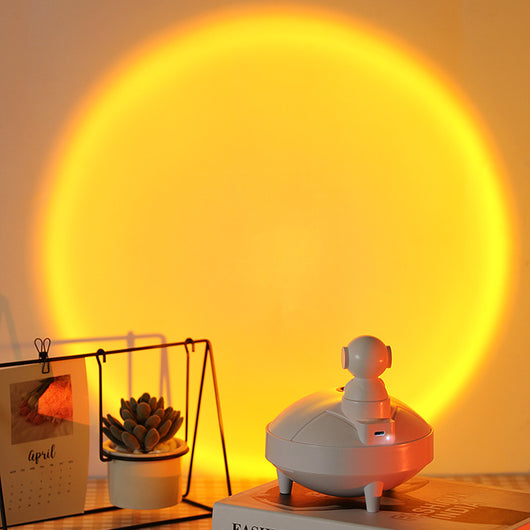 White astronaut sunset lamp humidifier with a 360-degree rotating head and two spray modes, on a light background. - Image 3
