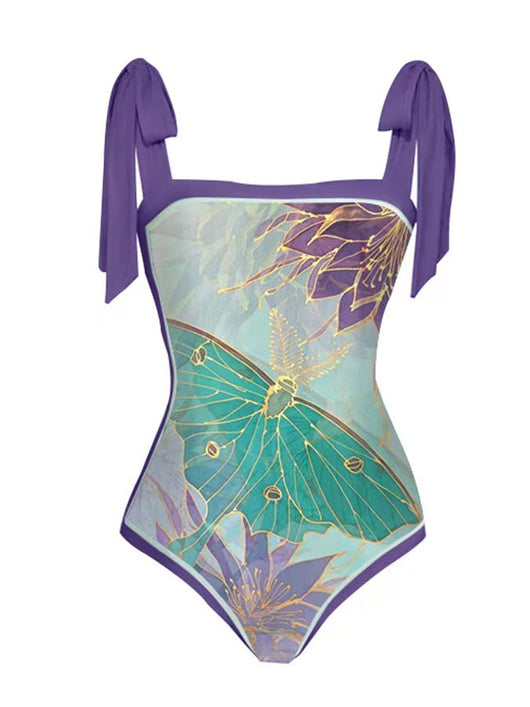 One-piece swimsuit with purple tie-shoulder straps, square neckline, and a teal butterfly and floral print. - Image 14