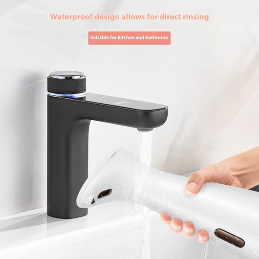 White automatic soap dispenser with an infrared sensor, dispensing blue liquid soap onto an outstretched hand. - Image 5