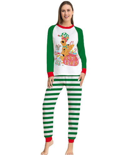 Woman wearing green and white striped holiday pajamas with a Scooby-Doo "Happy Holidays!" graphic on the top. - Image 5