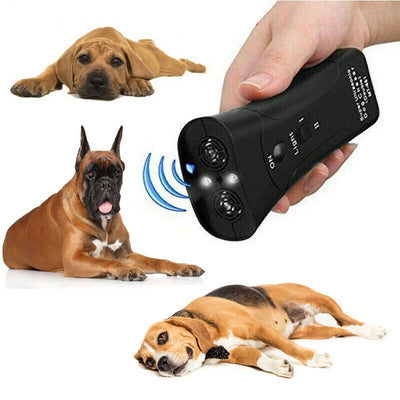 Yellow and black ultrasonic dog training devices with wrist straps, one in retail packaging. - Image 24