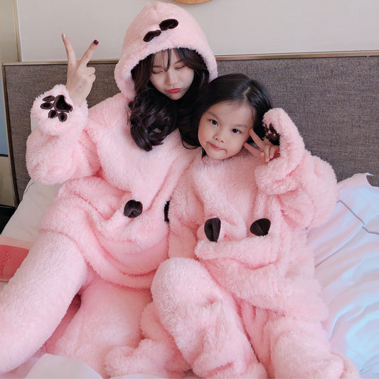 Mother and child wearing matching brown plush bear pajamas with hoods, ears, and embroidered paw gloves. - Image 2