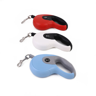 Blue and grey retractable dog leash with a black waste bag dispenser and a silver metal clip.