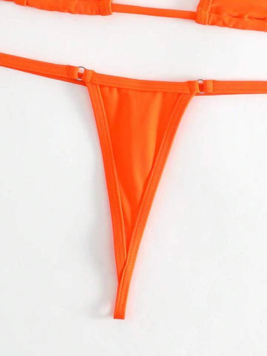 Orange solid color three-point bikini with a micro triangle top and thong bottom, modeled on a woman. - Image 30