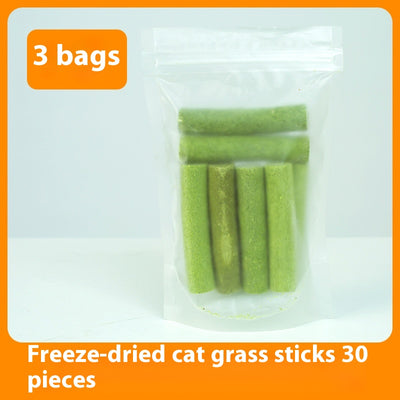 Clear plastic container of green freeze-dried cat grass chicken stick treats with a label featuring a grey cat. - Image 7