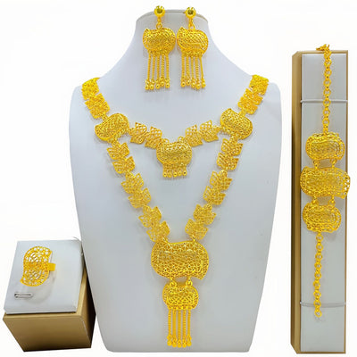 Gold-colored fashion jewelry set with a two-layer necklace, drop earrings, bracelet, and ring, all featuring intricate leaf and floral filigree designs. - Image 5