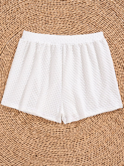 White polka dot three-piece swimsuit for women, featuring a halter bikini top with ruffled trim and matching high-waisted shorts. - Image 11