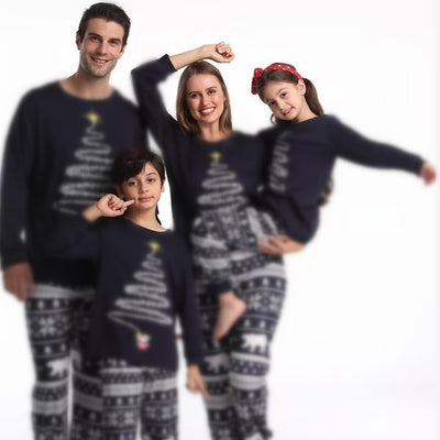 Family of four wearing matching red Christmas pajamas with a Christmas tree graphic and fair isle pattern. - Image 4