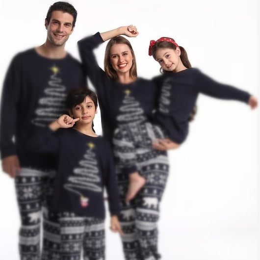 Family of four wearing matching red Christmas pajamas with a Christmas tree graphic and fair isle pattern. - Image 4