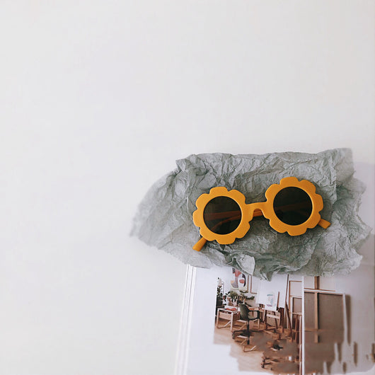 Orange flower-shaped sunglasses for babies and toddlers with dark lenses and a plastic frame. - Image 9