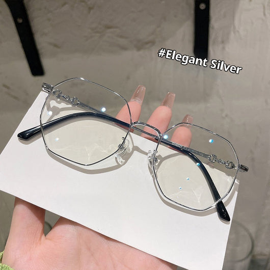 Rose gold frameless polygon anti-blue light glasses with clear lenses, held by a hand with pink nails. - Image 8