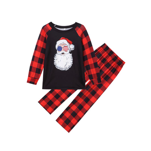 Christmas pajama set with a black long-sleeve top featuring a Santa head in American flag sunglasses and red and black buffalo plaid pants. - Image 3