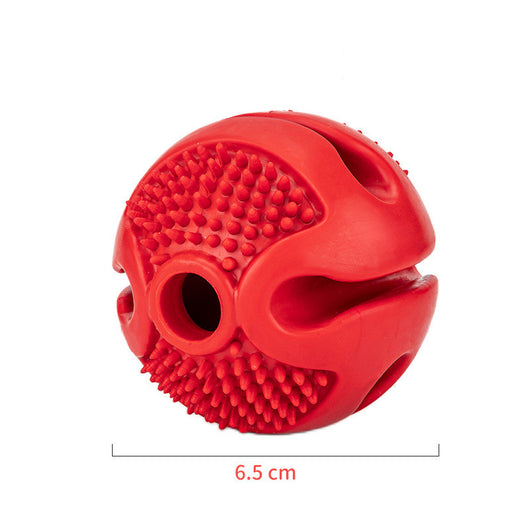 Red rubber pet chew toy ball with textured nubs and four openings for dispensing treats. - Image 10