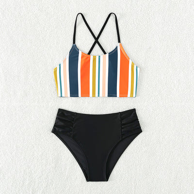 Girls' two-piece bikini swimsuit with a colorful striped crop top and solid black high-waisted ruched bottoms. - Image 6