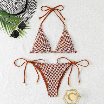 Blue and white mesh triangle bikini set with tie-side bottom and shell accents, displayed on a white beach towel. - Image 12