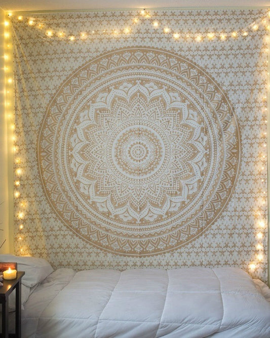 Black and white mandala tapestry with intricate floral and geometric patterns hanging on a bedroom wall.