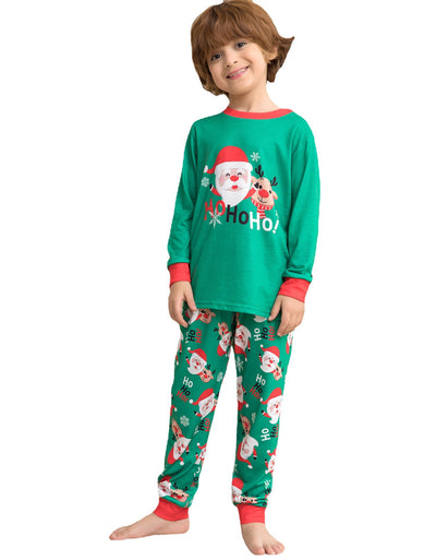 Family of four wearing matching green Christmas pajamas with Santa, reindeer, and "HoHo!" prints. - Image 6