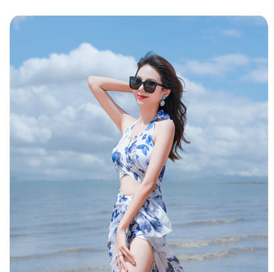 Women's light blue tropical leaf print three-piece swimsuit with short sleeve bikini top, bottoms, and sarong skirt. - Image 38
