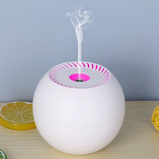 Dark wood grain spherical USB humidifier with a green light and mist emitting from the top, featuring a power button icon. - Image 6