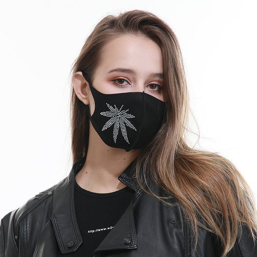 Black face mask with a sparkling rhinestone star design, modeled by a woman wearing a black leather jacket. - Image 9